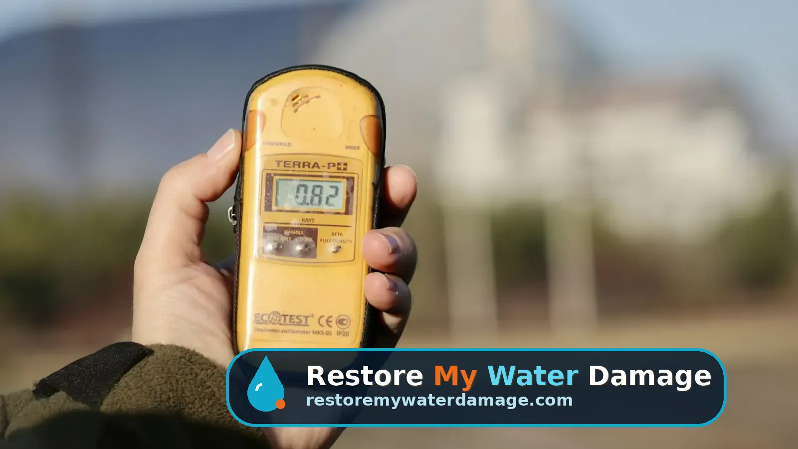 Hand holding a yellow digital meter like those used in water damage restoration Huntersville North Charlotte, NC