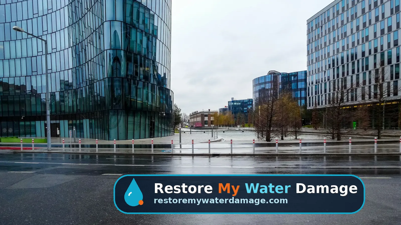Glass office buildings beside a rain-soaked street, a setting for water damage restoration Plano Richardson, TX