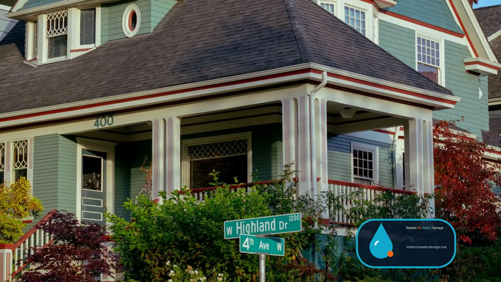 Craftsman house with a porch and garden, typical of homes that need water damage restoration in Washington